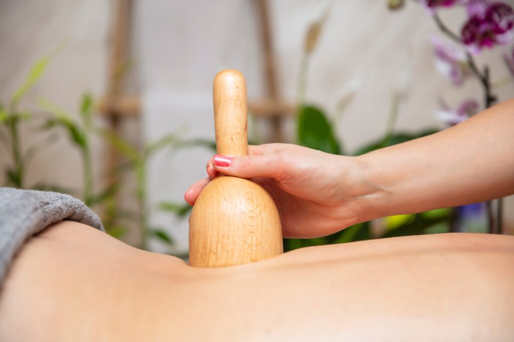 Maderotherapy massage with wooden swedish cup